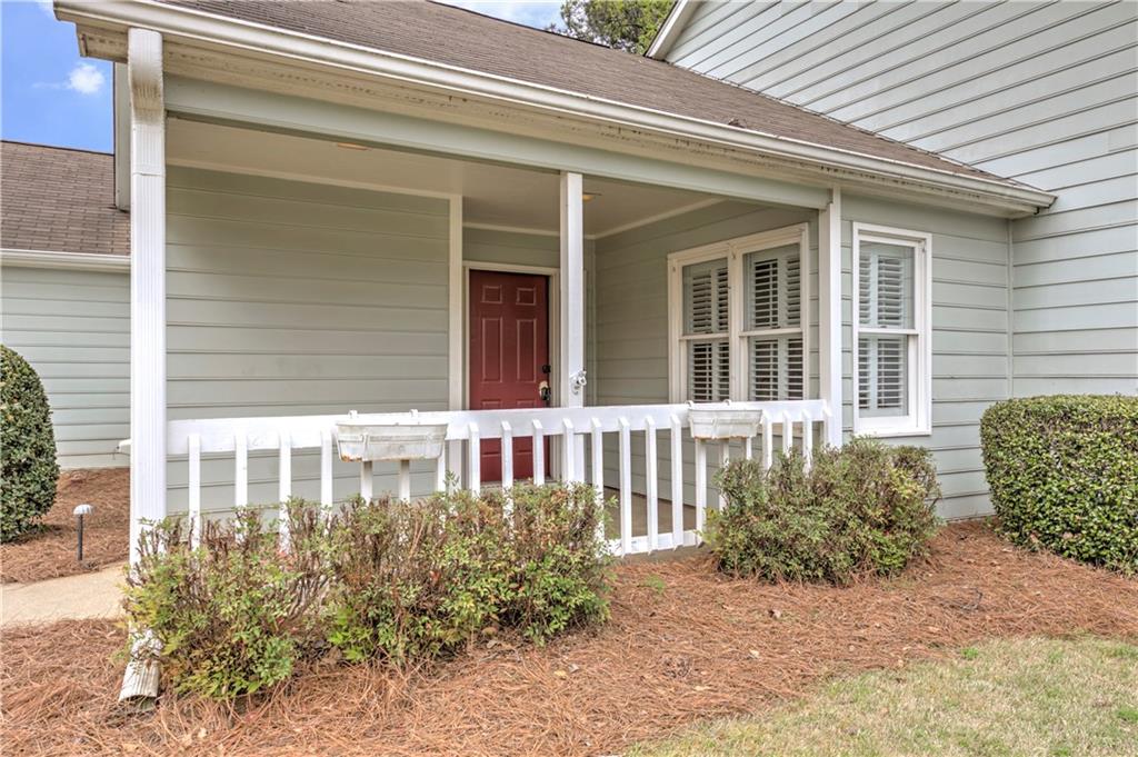 94 Robyn Way Marietta, GA 30062 - Photo 5 of 40 a view of a brick house with large windows