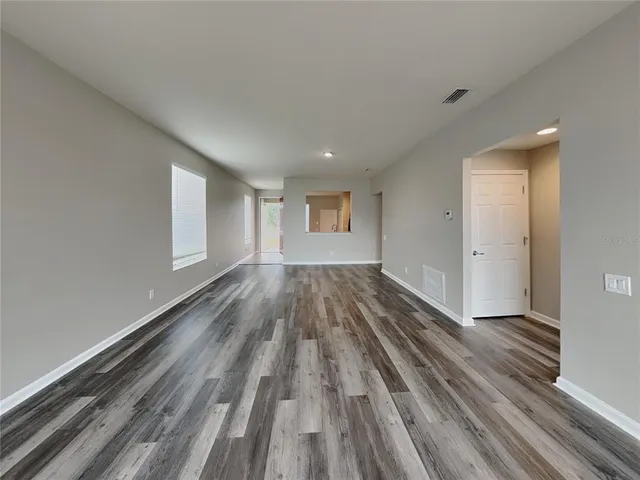a view of wooden floor in an empty room