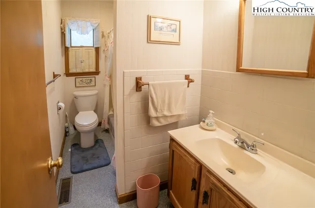 a bathroom with a sink and toilet