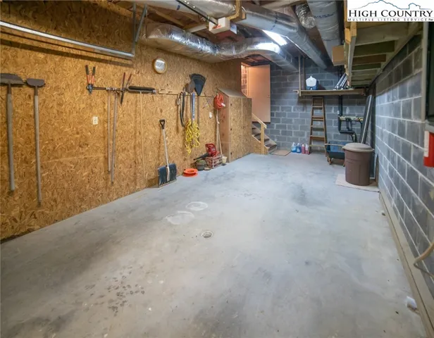 a view of empty room with wooden walls