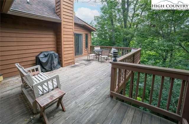 a view of two chairs in the balcony