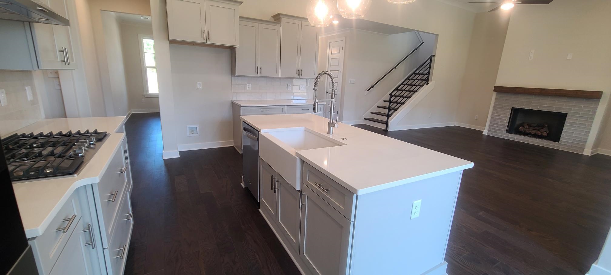 501 Halle Park Drive Collierville, TN 38017 - Photo 12 of 37 a kitchen with a sink a stove and a refrigerator