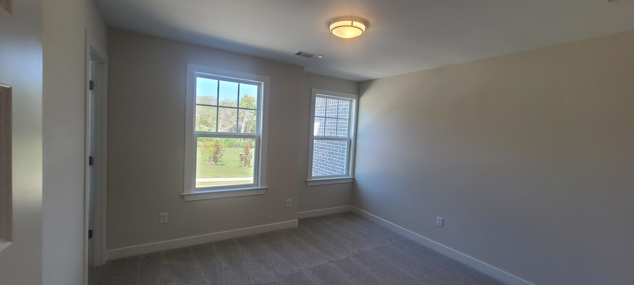 501 Halle Park Drive Collierville, TN 38017 - Photo 27 of 37 an empty room with windows