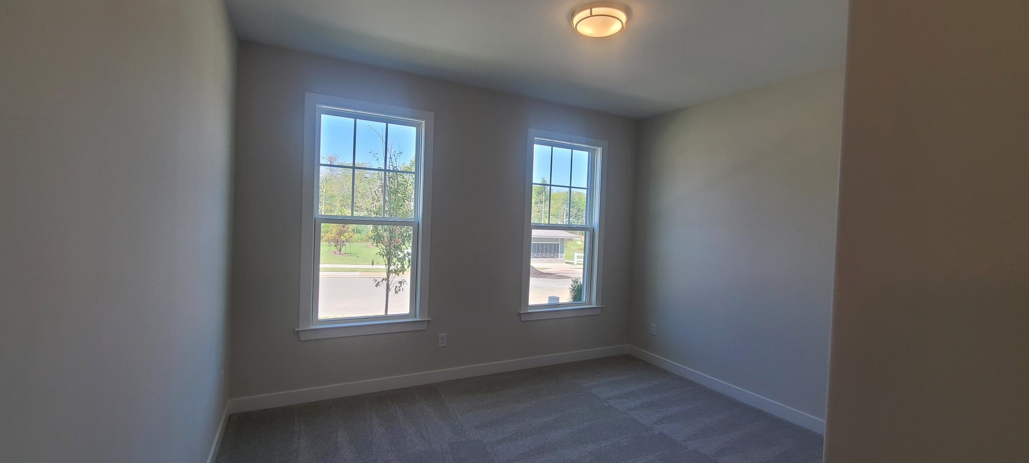 501 Halle Park Drive Collierville, TN 38017 - Photo 5 of 37 an empty room with windows