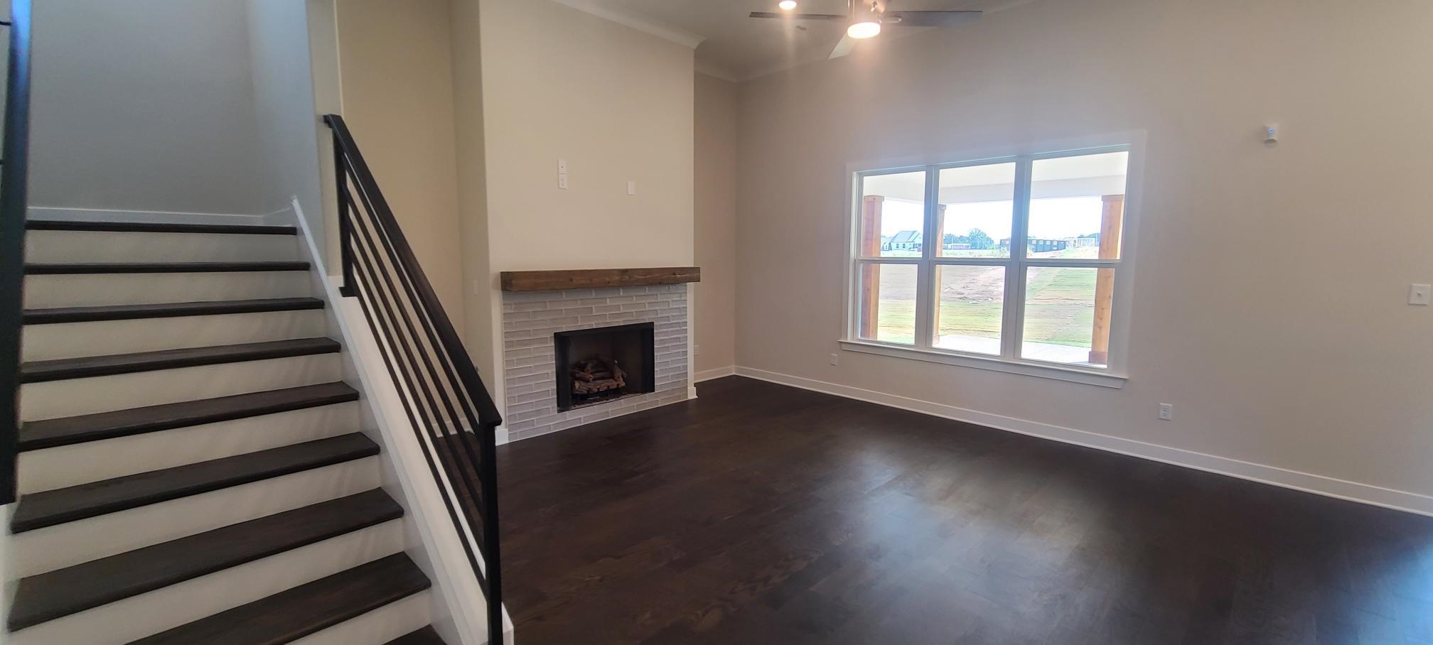 501 Halle Park Drive Collierville, TN 38017 - Photo 7 of 37 a view of a livingroom with wooden floor and a fireplace