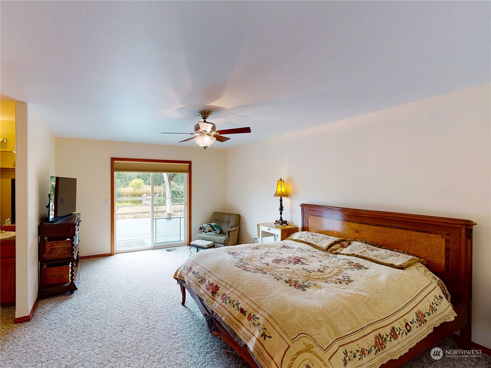 61 Camelot Road Sequim, WA 98382 - Photo 14 of 33 a bed sitting in a bedroom next to a window