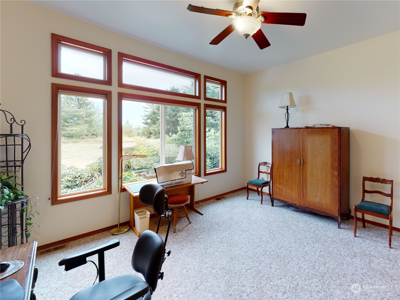 61 Camelot Road Sequim, WA 98382 - Photo 18 of 33 a living room with furniture and a window