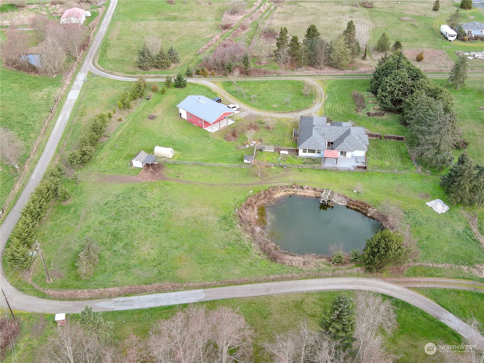 61 Camelot Road Sequim, WA 98382 - Photo 23 of 33 a small pool is sitting in the middle of a lake