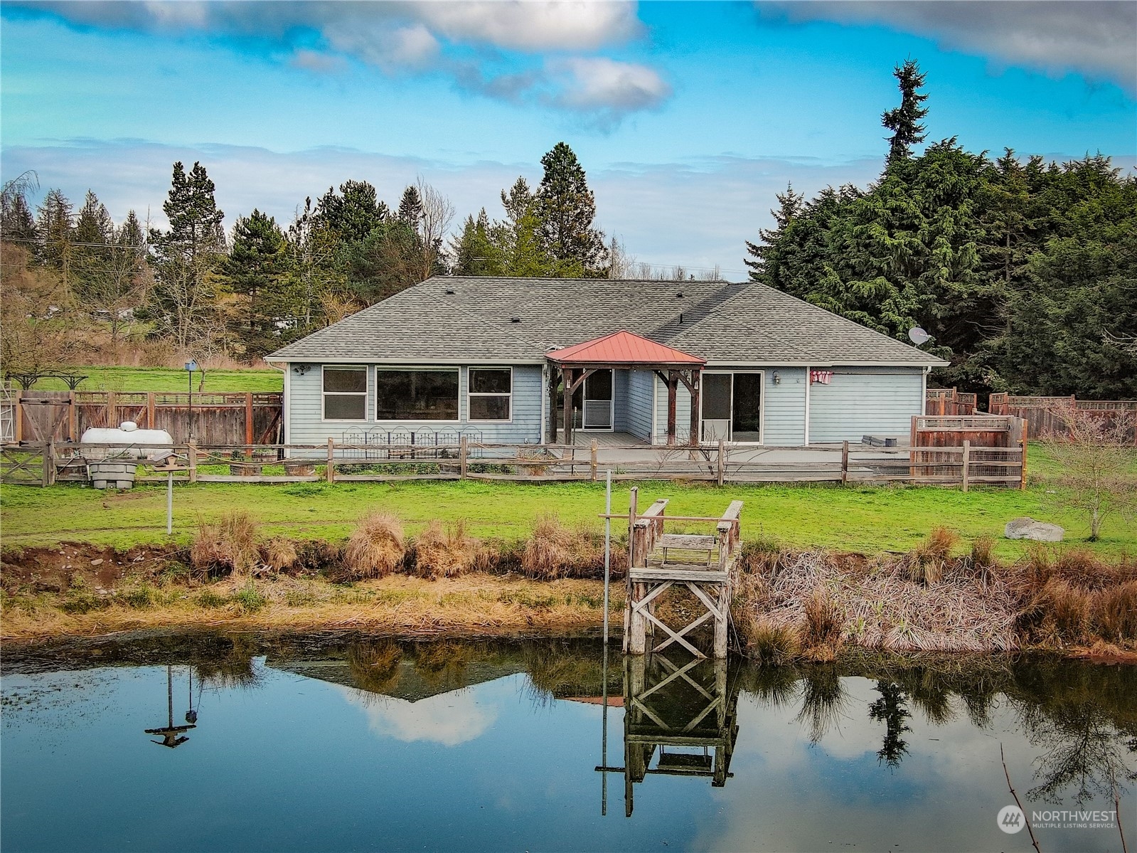 61 Camelot Road Sequim, WA 98382 - Photo 25 of 33 a view of a house with swimming pool and view of a lake