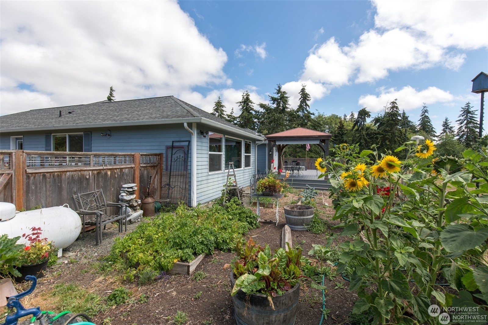 61 Camelot Road Sequim, WA 98382 - Photo 26 of 33 a front view of a house with patio