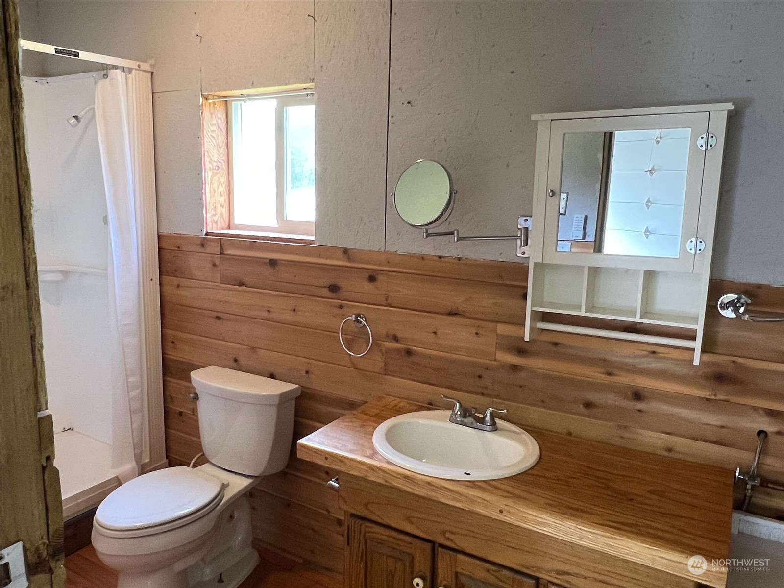 61 Camelot Road Sequim, WA 98382 - Photo 30 of 33 a bathroom with a toilet a sink and mirror
