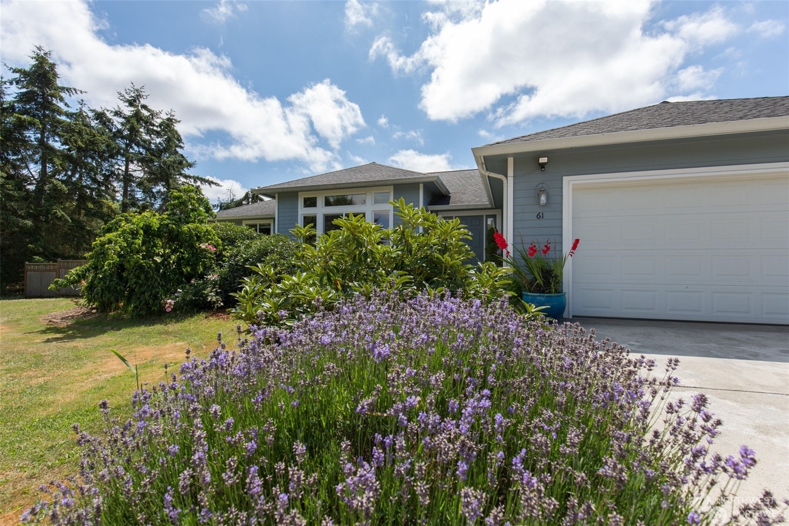 61 Camelot Road Sequim, WA 98382 - Photo 3 of 33 a front view of a house with a yard