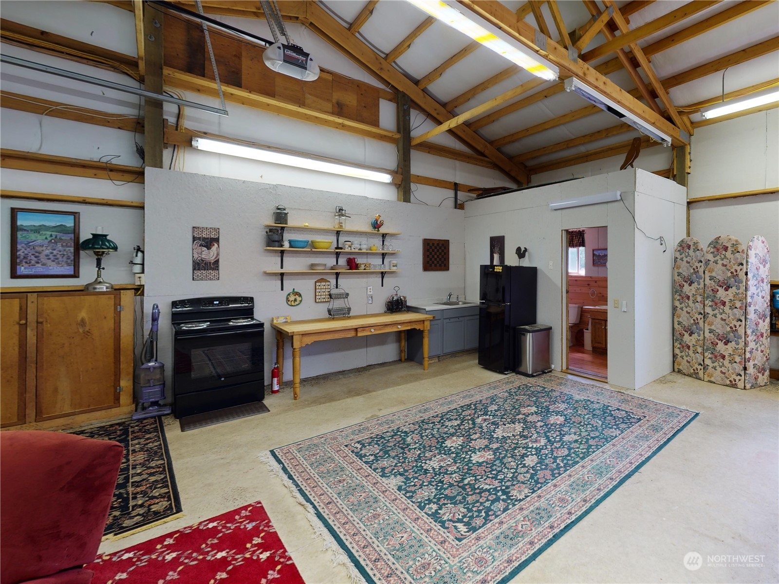 61 Camelot Road Sequim, WA 98382 - Photo 31 of 33 a living room with lots of furniture and a rug