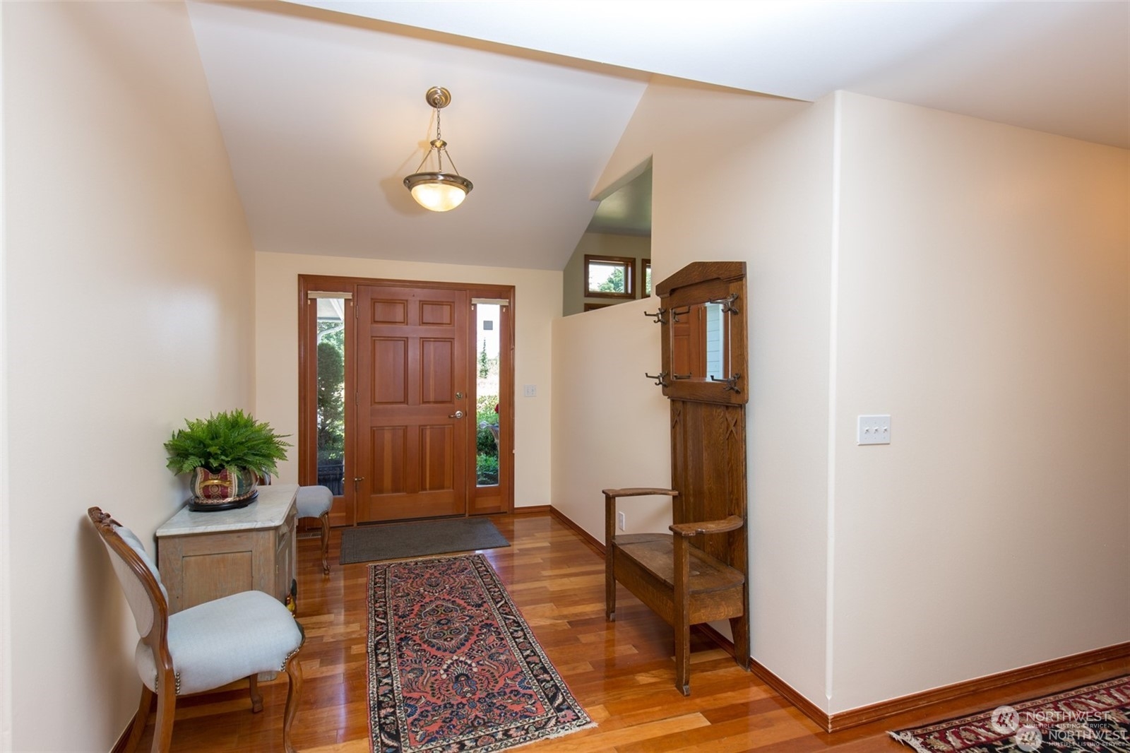 61 Camelot Road Sequim, WA 98382 - Photo 6 of 33 a very nice looking room with wooden floor and a potted plant