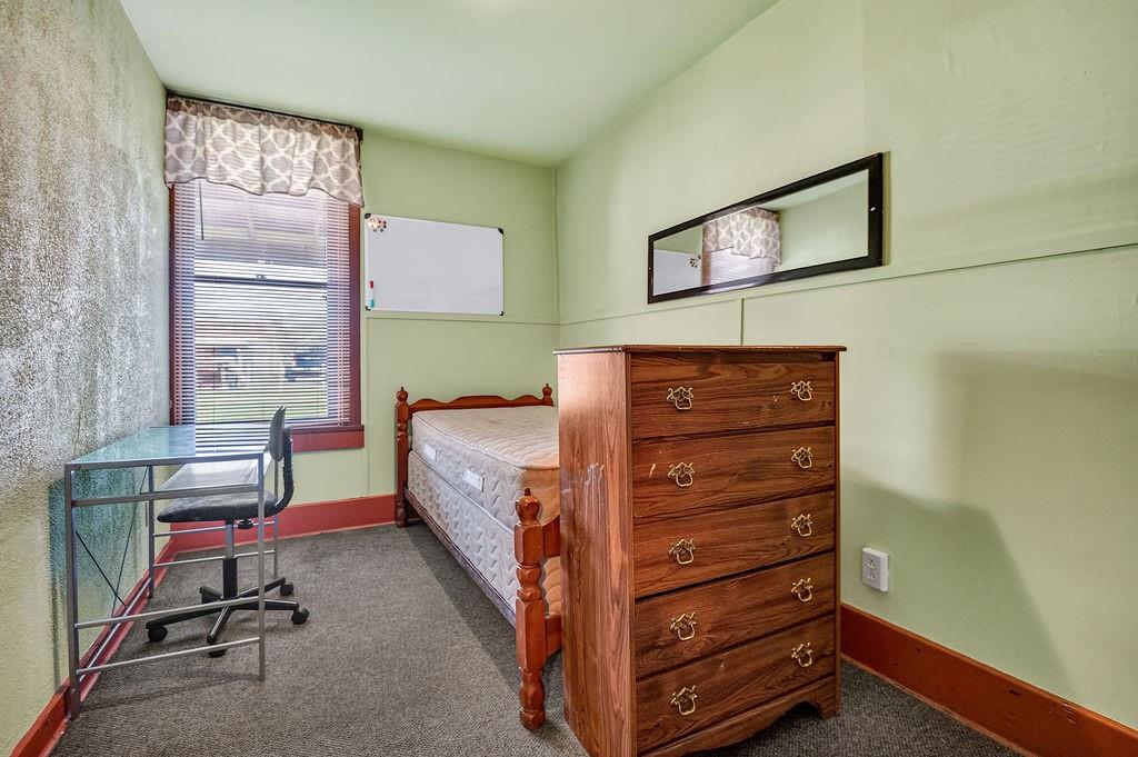 1023 Philadelphia Street Indiana, PA 15701 - Photo 18 of 40 a bedroom with a bed and a dresser in it