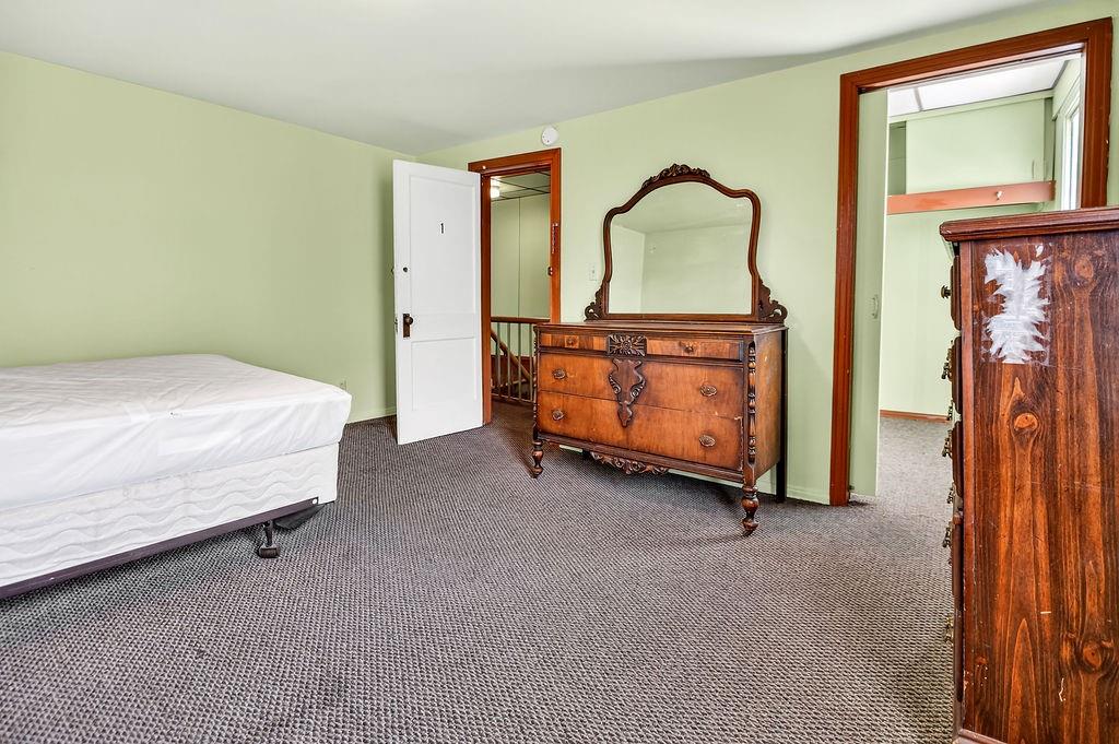 1023 Philadelphia Street Indiana, PA 15701 - Photo 20 of 40 a bed room with a bed and a chair