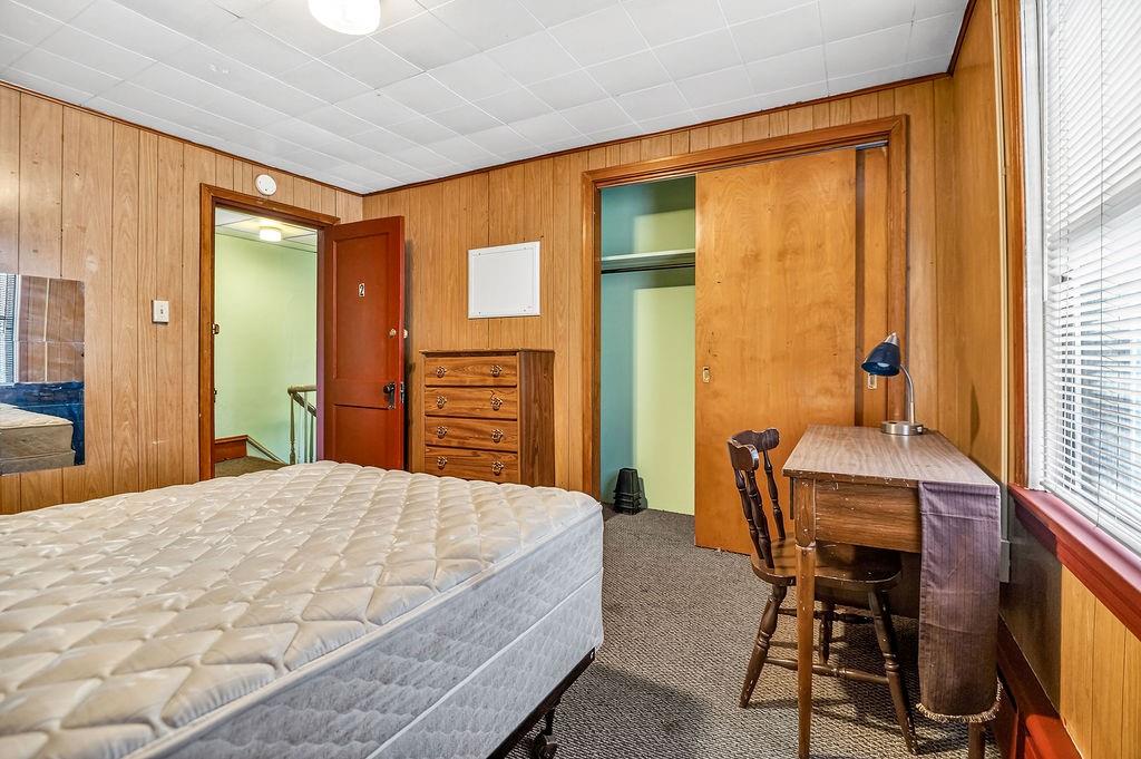 1023 Philadelphia Street Indiana, PA 15701 - Photo 21 of 40 a bedroom with a bed and a table in it