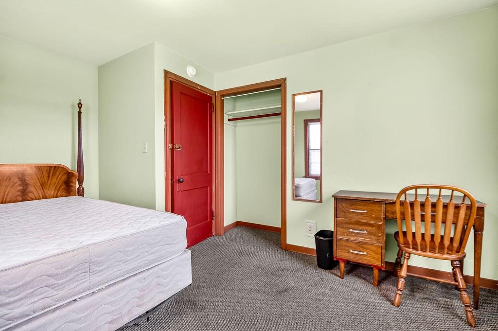 1023 Philadelphia Street Indiana, PA 15701 - Photo 24 of 40 a bedroom with a bed and a chair