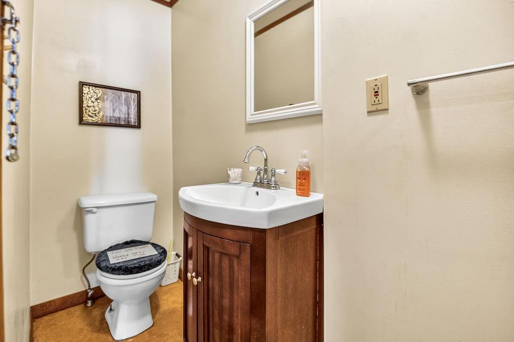 1023 Philadelphia Street Indiana, PA 15701 - Photo 27 of 40 a bathroom with a toilet a sink and a mirror