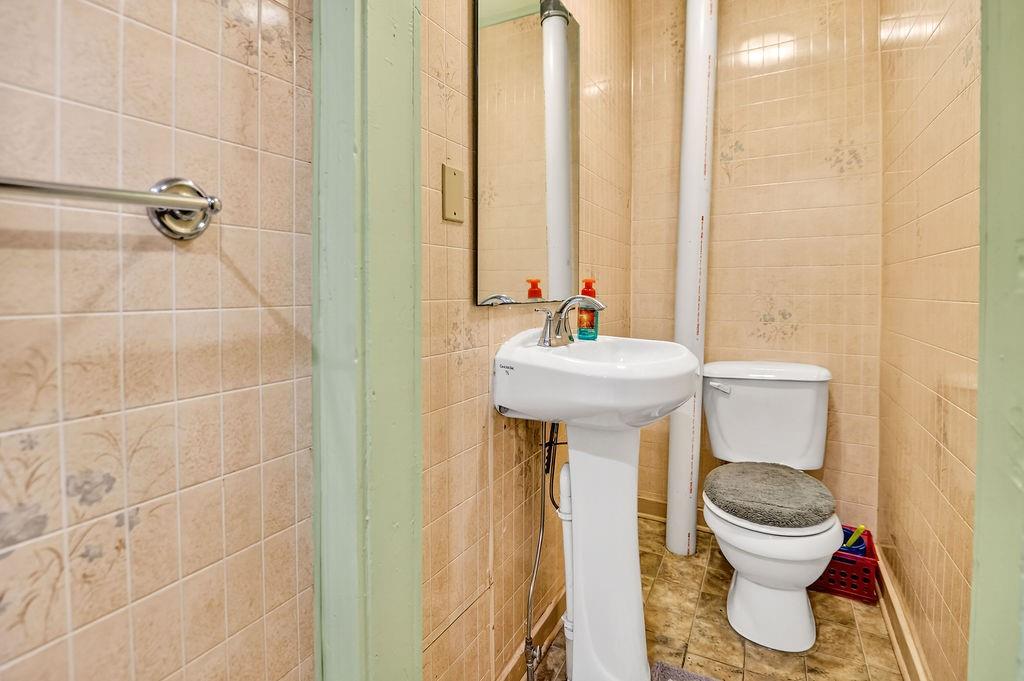 1023 Philadelphia Street Indiana, PA 15701 - Photo 38 of 40 a bathroom with a toilet and a sink