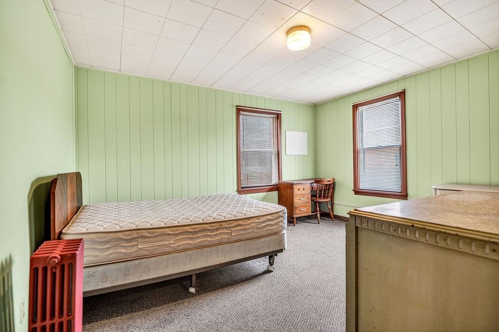 1023 Philadelphia Street Indiana, PA 15701 - Photo 7 of 40 a bedroom with a bed and a chandelier