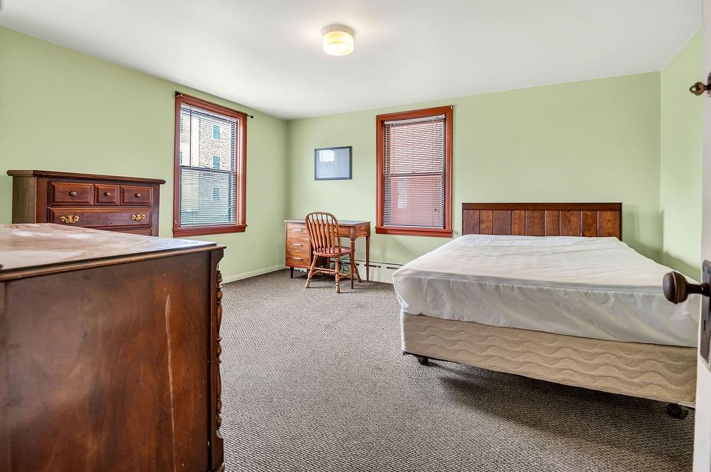 1023 Philadelphia Street Indiana, PA 15701 - Photo 8 of 40 a bedroom with a bed chair and window
