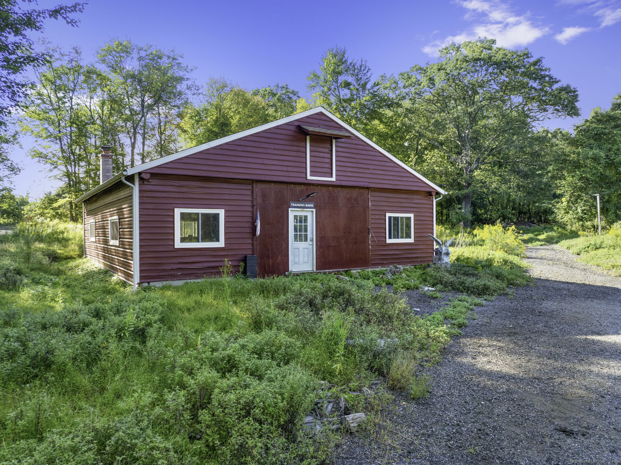 100 Hunters Mountain Road Naugatuck, CT 06770 - Photo 4 of 16 a view of a house with yard and a garden