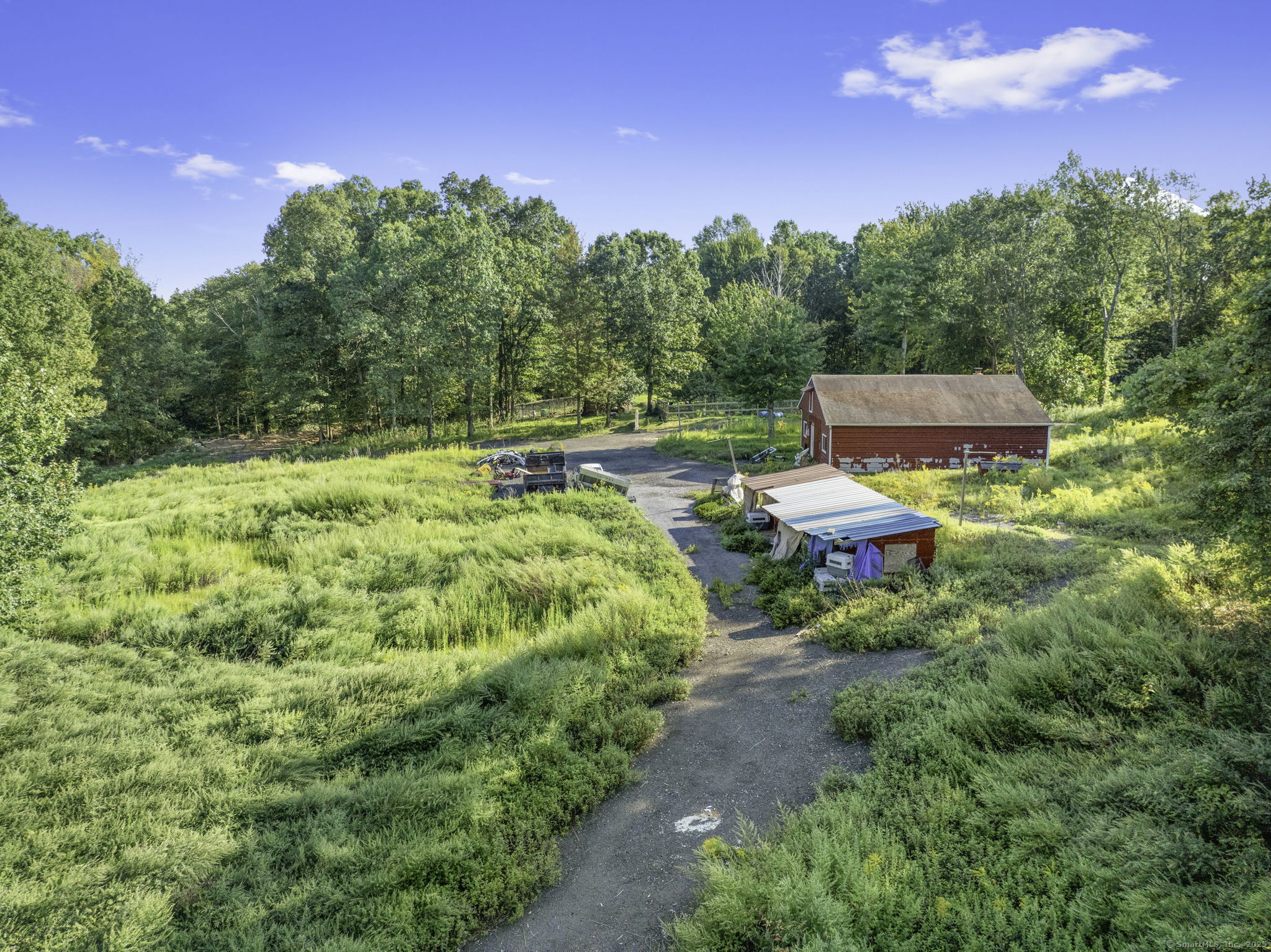 100 Hunters Mountain Road Naugatuck, CT 06770 - Photo 5 of 16 a backyard of a house with table and chairs plants and large trees