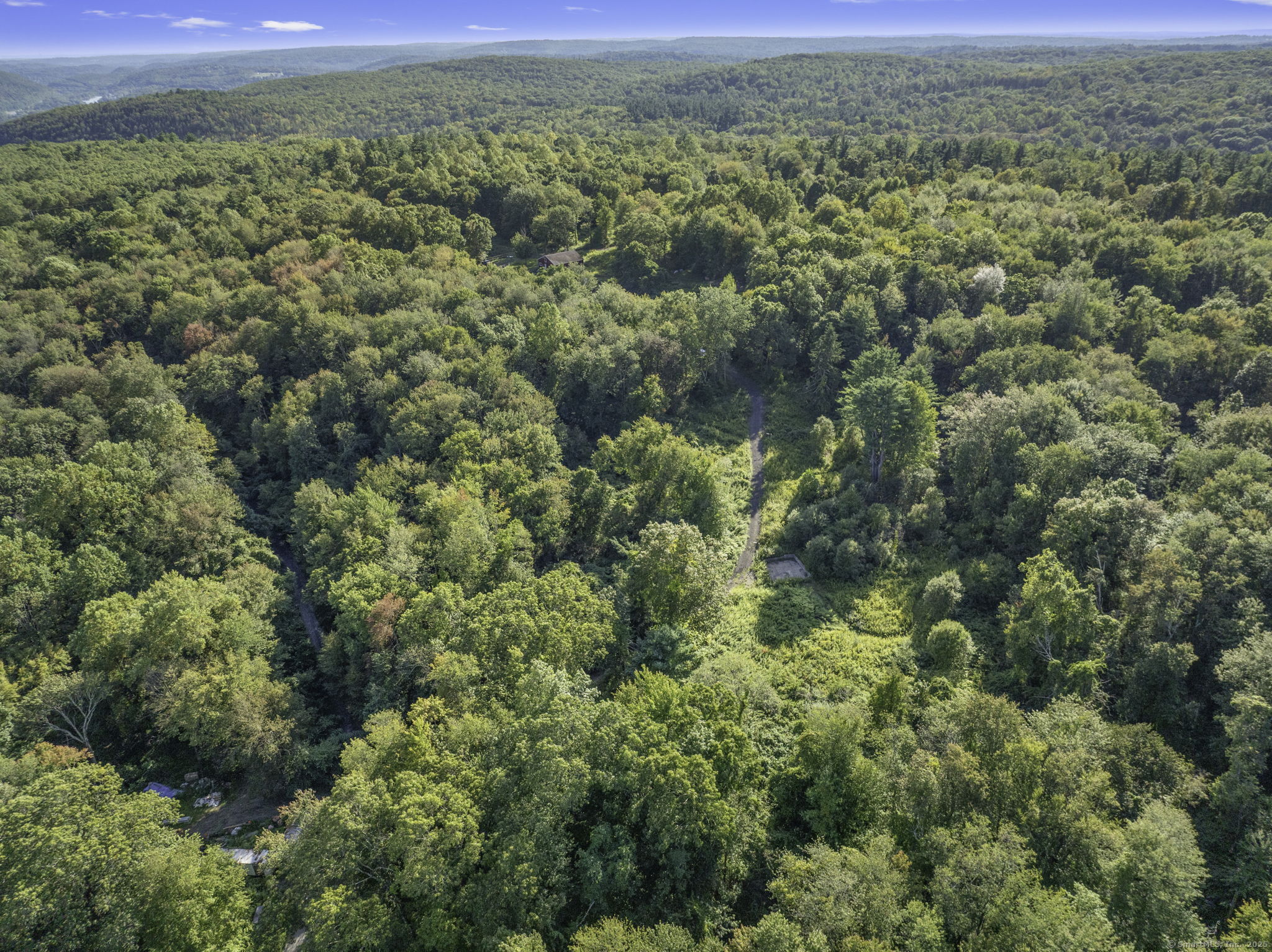 100 Hunters Mountain Road Naugatuck, CT 06770 - Photo 7 of 16 a view of a city with lush green forest