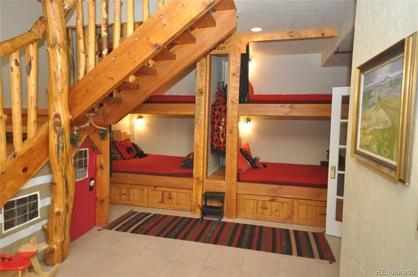 a living room with furniture a rug and a large window