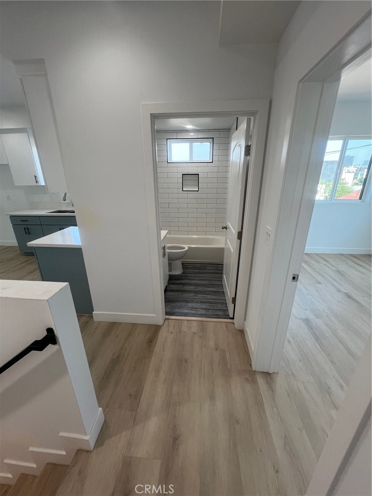 1128 South Ardmore Avenue Los Angeles, CA 90006 - Photo 11 of 30 wooden floor in a room