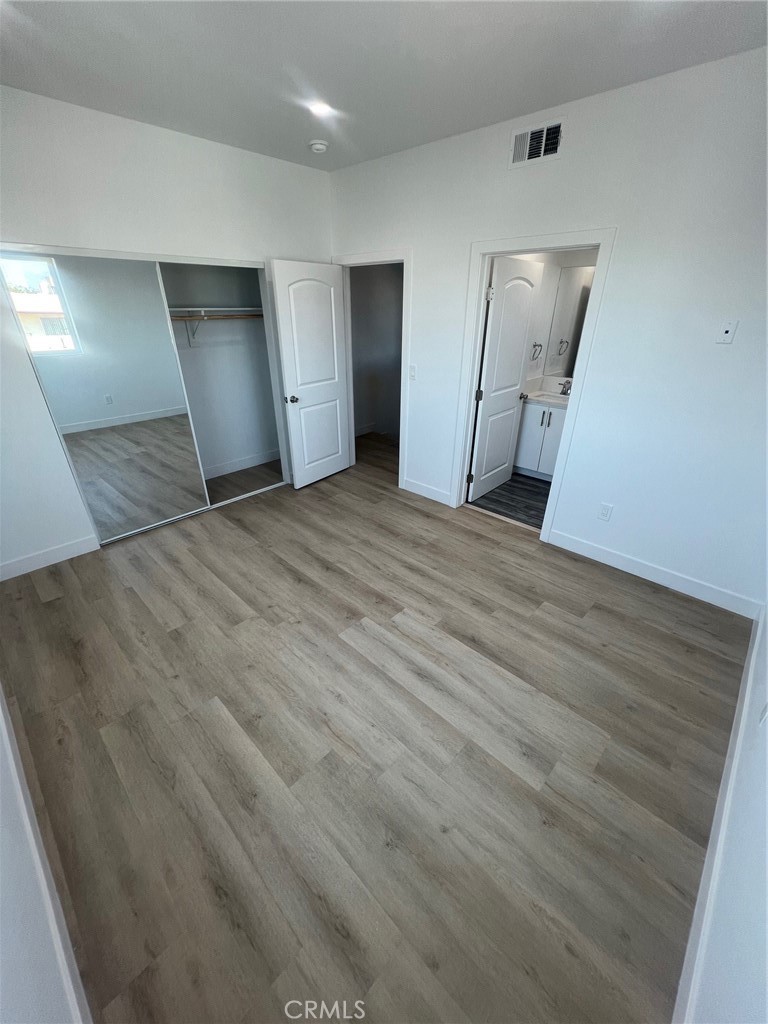 1128 South Ardmore Avenue Los Angeles, CA 90006 - Photo 14 of 30 a view of empty room with wooden floor