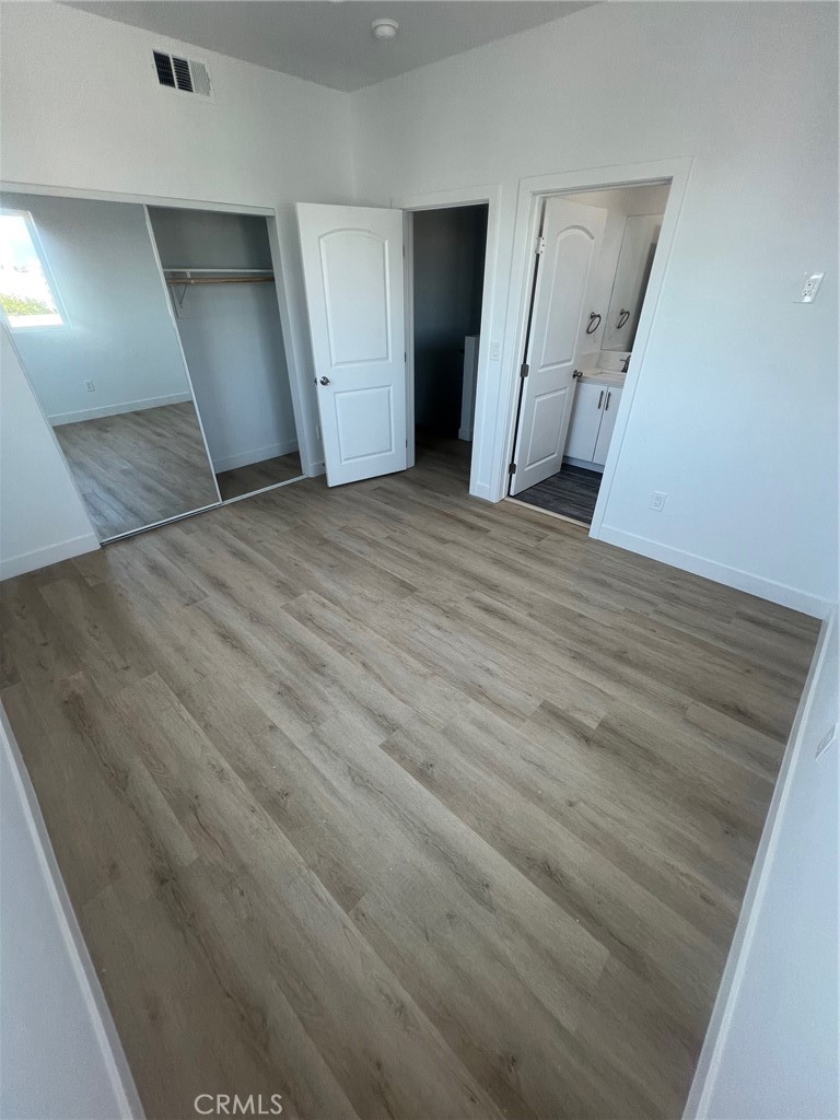 1128 South Ardmore Avenue Los Angeles, CA 90006 - Photo 20 of 30 a view of empty room with wooden floor