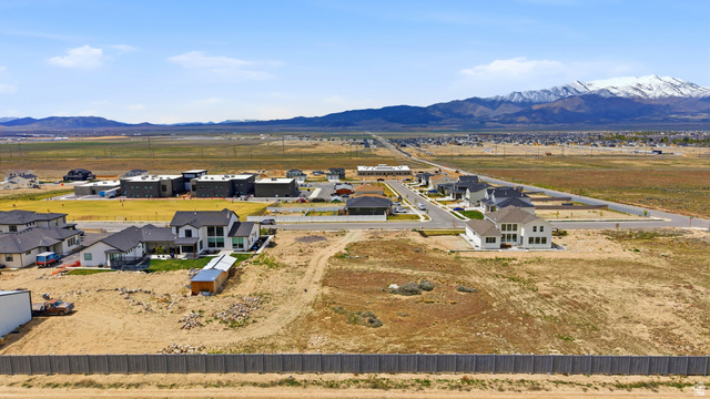 2930 Jojo Road, Unit 110 Eagle Mountain, UT 84005 - Photo 16 of 22 Aerial view of residential area with a mountainous background