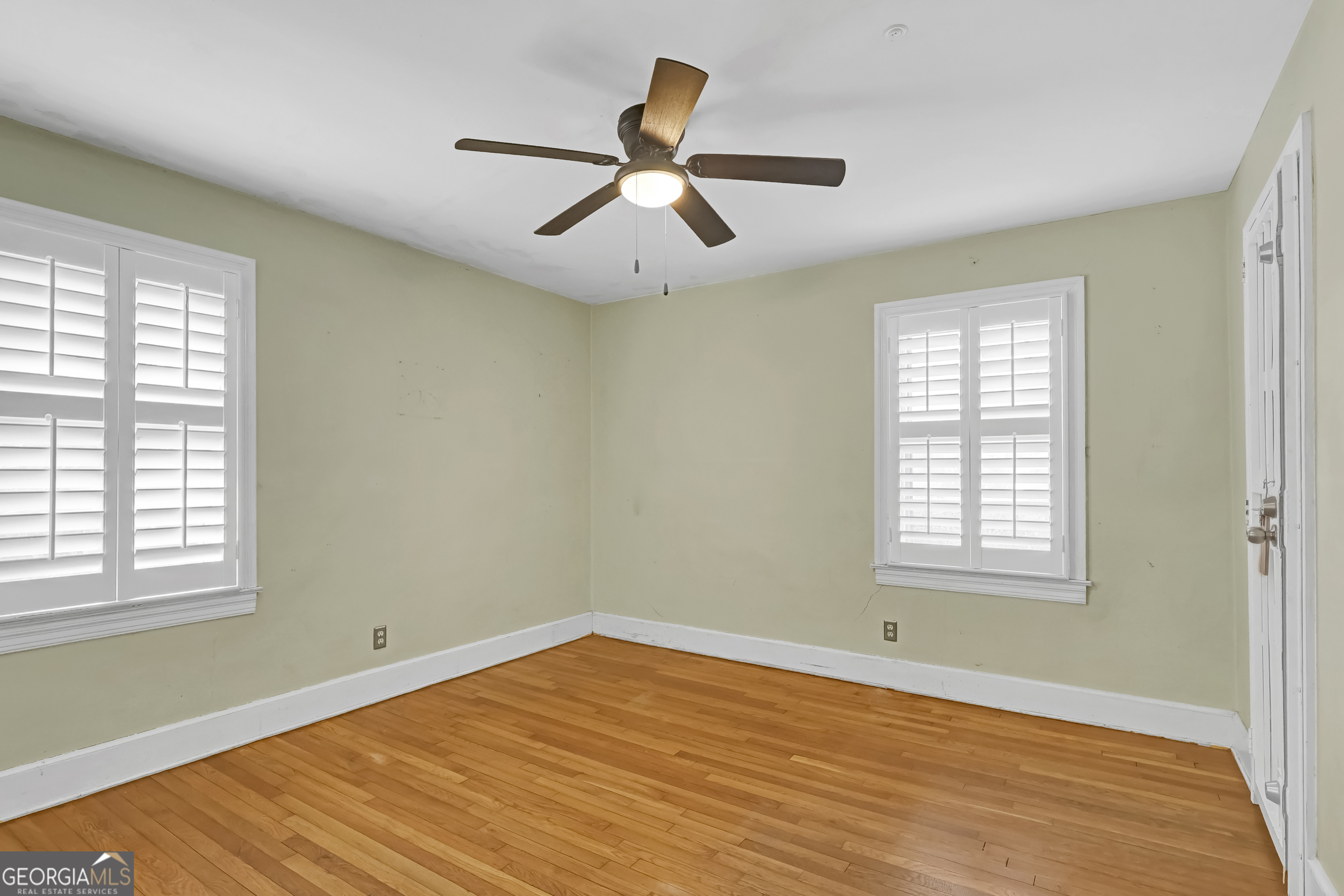 1077 Helen Street Morrow, GA 30260 - Photo 13 of 18 a view of an empty room with wooden floor and a window