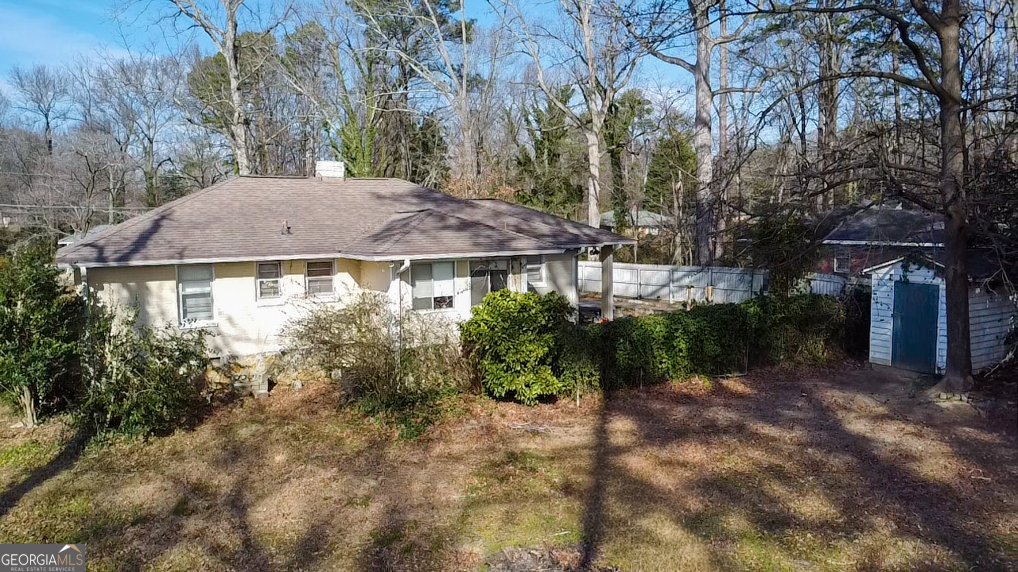 1077 Helen Street Morrow, GA 30260 - Photo 17 of 18 a view of a house with a yard and plants
