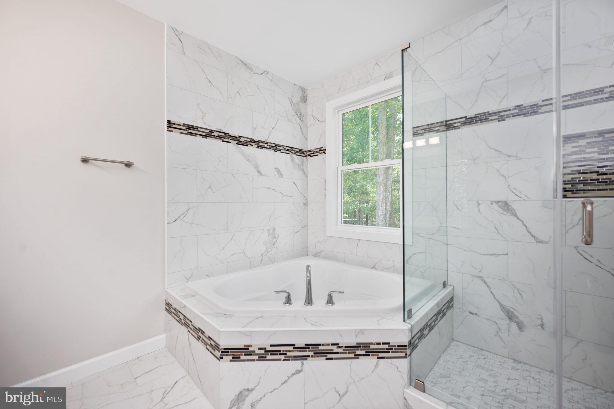 107 Gold Valley Road Locust Grove, VA 22508 - Photo 13 of 19 a bathroom with a bath tub and shower