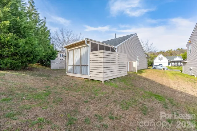 a view of a house with a backyard