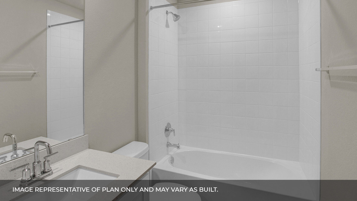 135 Morning Glory Loop Kyle, TX 78640 - Photo 14 of 22 a bathroom with a sink a toilet and shower