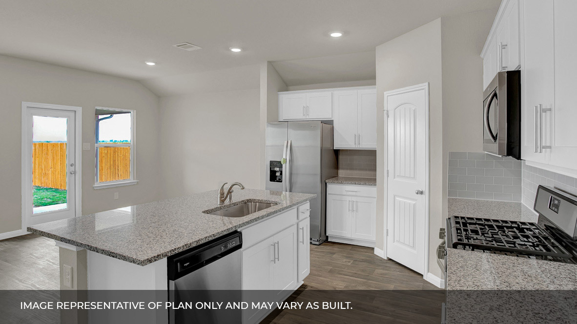 135 Morning Glory Loop Kyle, TX 78640 - Photo 5 of 22 a kitchen with a sink a refrigerator and a stove
