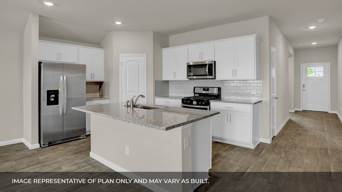 135 Morning Glory Loop Kyle, TX 78640 - Photo 8 of 22 a kitchen with stainless steel appliances granite countertop a sink a stove a refrigerator a microwave and cabinets