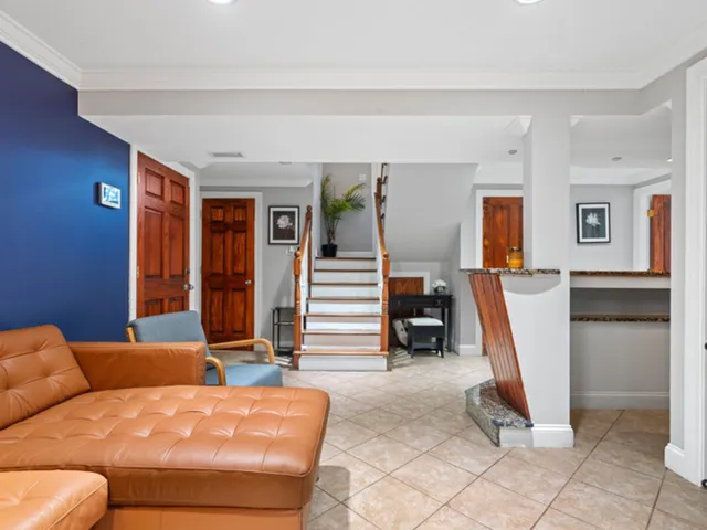 a bedroom with furniture and a rug