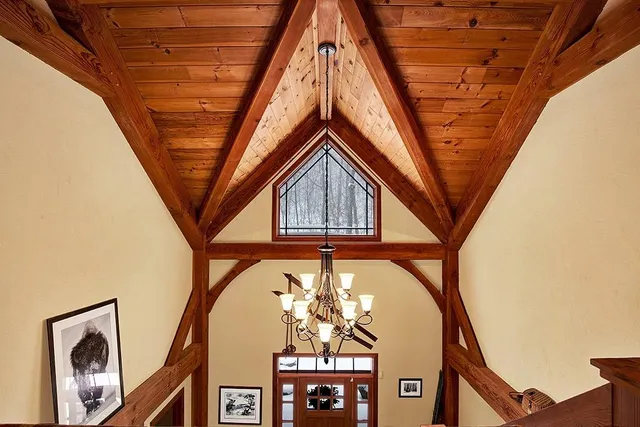 a bed sitting in a room next to a window