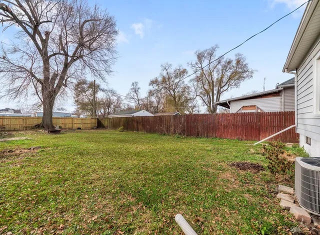a view of backyard with green space