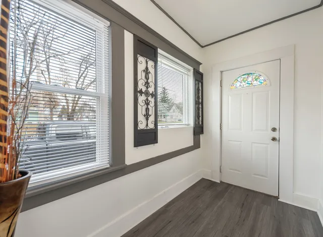 a view of an empty room with a window