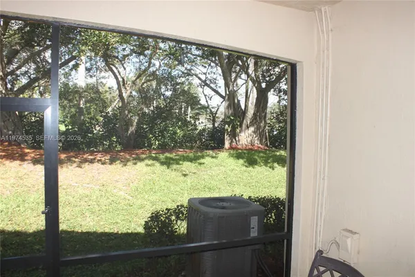 a kitchen with stainless steel appliances kitchen island granite countertop a refrigerator and a stove top oven