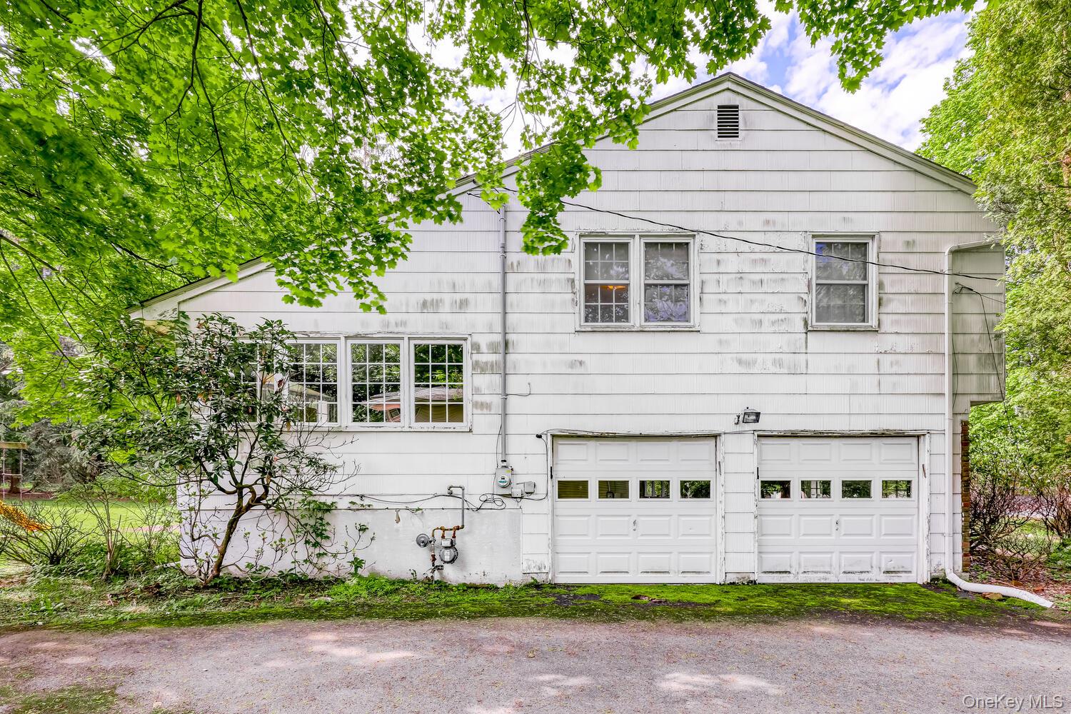 38 Forshay Road Monsey, NY 10952 - Photo 3 of 34 a front view of a house with a yard and garage