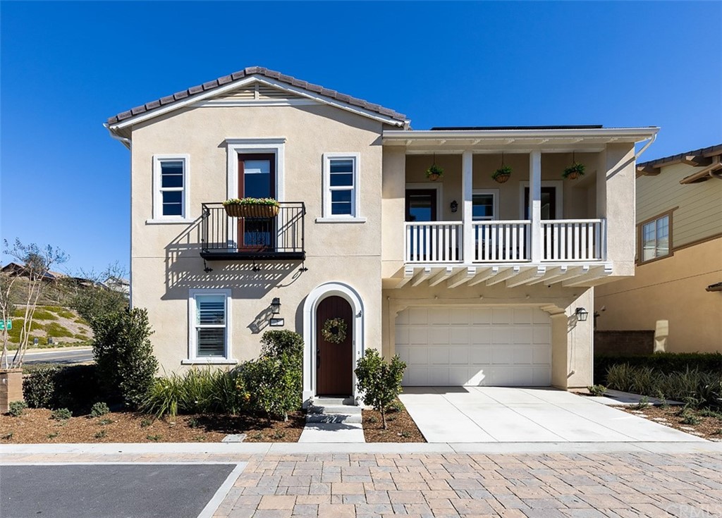 a front view of a house with yard