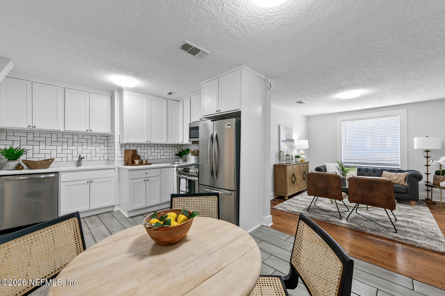 715 Ralph Street Jacksonville, FL 32204 - Photo 21 of 21 a kitchen with a refrigerator coffee maker on top of a kitchen island