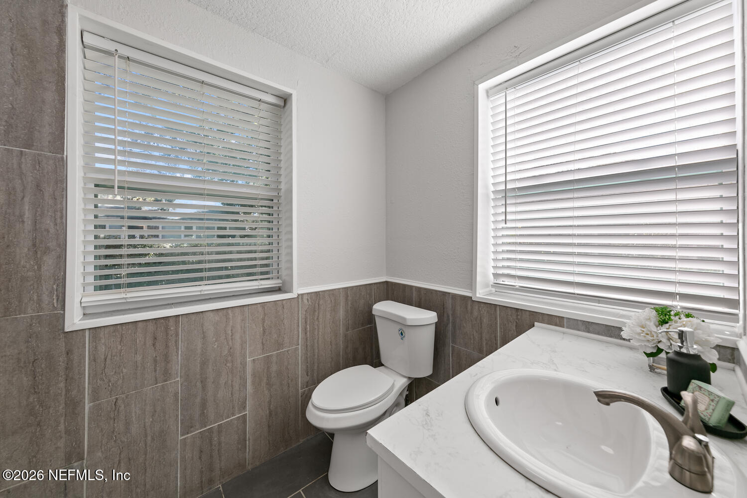 715 Ralph Street Jacksonville, FL 32204 - Photo 11 of 21 a bathroom with a toilet sink and mirror